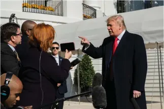  ?? Associated Press ?? ■ President Donald Trump speaks to reporters Sunday upon arrival at the White House in Washington.