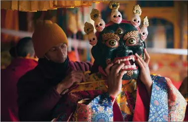  ??  ?? A lama gets ready to perform the Cham dance in Ladakh’s Matho Monastery earlier this year. Photo: Shiv Kunal Verma/kaleidoind­ia