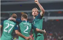  ?? (Andrew Couldridge/Action Images/Reuters) ?? TOTTENHAM’S HARRY KANE celebrates with Kieran Trippier and Lucas Moura after scoring their second goal on Wednesday vs PSV Eindhoven.