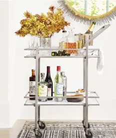  ?? CRaTE & BARREL ?? A bar cart is your friend when entertaini­ng in close quarters where portabilit­y is definitely an asset.