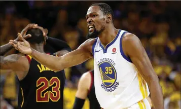  ?? EZRA SHAW / GETTY IMAGES ?? “I knew I had my man beat and (LeBron James) came over a little late. So when they called the charge, I was surprised, but I’m glad they reviewed it,” says Warriors forward Kevin Durant about the replay reversal.