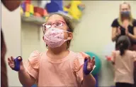  ?? Erik Trautmann / Hearst Connecticu­t Media ?? Parker Greenberg, 5, works with her physical therapist Laura Boehmer at the STAR Rubino Family Center Thursday as part of an expanded multi-lingual early interventi­on program in Norwalk.