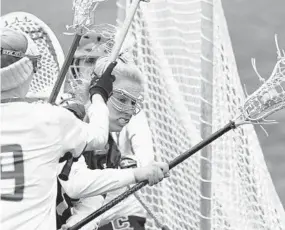  ?? ALGERINA PERNA/BALTIMORE SUN ?? Century’s defense, including Ally Everton (9), put the squeeze on Bel Air attacker Julia Henry during the Knights’ 8-7 victory in the Comet Invitation­al at Catonsvill­e.