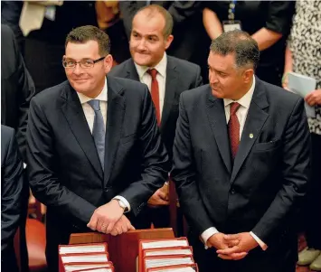  ??  ?? Premier Daniel Andrews, Deputy Premier James Merlino and former Victorian Speaker Telmo Languiller.