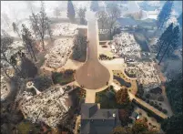  ?? LIPO CHING/TNS 2018 ?? Aerial footage shows homes destroyed by the Camp fire near the Paradise Plaza off Clark Road in Paradise, California, on Nov. 15, 2018. The estimated damage climate-fueled disasters are likely to inflict over the next 30 years is very high.