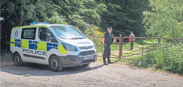  ??  ?? Police at Loch Kinnordy Nature Reserve, where the body was found.