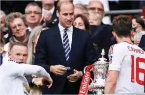  ??  ?? Trophy: Prince William hails the 2016 FA Cup Final winners Man Utd