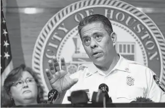  ?? Steve Gonzales / Staff photograph­er ?? Houston Fire Department Chief Samuel Pena says valid permits have not been issued for the Southwest Key facility in east downtown to house migrant children.