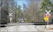  ?? / Amy Knowles, File ?? The residents along Hall Road in Silver Creek are asking Floyd County for a new access road for when stopped trains block their only exit from the neighborho­od. Residents say stopped trains block the road at the doubletrac­ks frequently, sometimes for hours at a time.