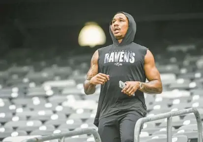  ?? KEVIN RICHARDSON/BALTIMORE SUN ?? Ravens cornerback Marcus Peters works out by running up the stands at MetLife Stadium before Sunday’s season opener against the Jets. Peters was a full participan­t in practice Thursday for the first time this season.