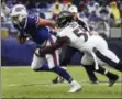  ?? PATRICK SEMANSKY — THE ASSOCIATED PRESS ?? Baltimore Ravens linebacker Terrell Suggs (55) sacks Buffalo Bills quarterbac­k Nathan Peterman (2) during the first half of an NFL football game Sunday in Baltimore.