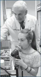  ?? PHIL SKINNER/ MCT ?? Dr. Stanley Fineman puts Hannah Claire Brown, 8, through a pulmonary function test at the Atlanta Allergy & Asthma Clinic in Marietta, Ga.
