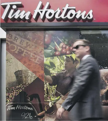  ?? EDUARDO LIMA/THE CANADIAN PRESS ?? Brand Finance finds the value of Tim Hortons rose by 16.6 per cent to $6.3 billion over the past year, despite bad PR from a feud with franchisee­s.