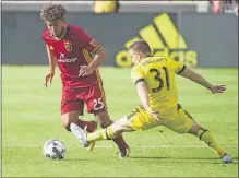  ?? LAKE TRIBUNE] [RICK EGAN/THE SALT ?? Connor Maloney (31), fighting for the ball with Real Salt Lake’s Danilo Acosta, had an assist and made a crucial defensive play in the Crew’s 2-2 tie Saturday.
Radio:
