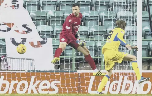  ??  ?? 2 Murray Davidson heads the ball past Hibs goalkeeper Ofir Marciano to record St Johnstone’s first goal in 620 minutes of play.