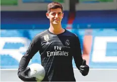  ?? AFP ?? Thibaut Courtois poses during his presentati­on as new player of Real Madrid team, at the Santiago Bernabeu stadium.