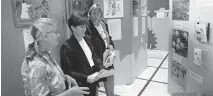  ?? [OKLAHOMAN ARCHIVES] ?? In this 1997 photo, Sadie Mast, left, looks at a portion of the Peace Factory traveling exhibit with exhibit facilitato­rs-guides Laura Neece-Baltaro and Sharon Wilson. The interactiv­e exhibit promoted universal brotherhoo­d and traveled coast to coast for two years.