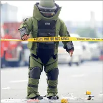  ?? AFP ?? A member of the Philippine National Police Explosives and Ordnance Division, inspects the remains of the improvised explosive device during a bomb disposal exercise in metro Manila —