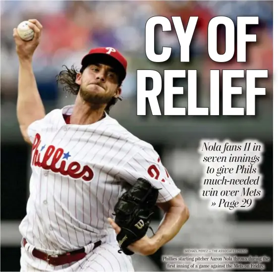 ?? MICHAEL PEREZ — THE ASSOCIATED PRESS ?? Phillies starting pitcher Aaron Nola throws during the first inning of a game against the Mets on Friday.