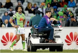  ?? PHOTO: MARK NOLAN/GETTY IMAGES. ?? Canberra backrower Iosia Soliola looks on as Melbourne’s Billy Slater is driven off GIO Stadium.