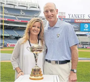  ?? AFP ?? US captain Jim Furyk and his wife Tabitha pose with the Ryder Cup trophy at Yankee Stadium on Monday.