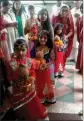  ??  ?? Young girls participat­ing in the jaal yathra. Above: Priests of the Shri Laxmi Narayan Temple conducting rituals.