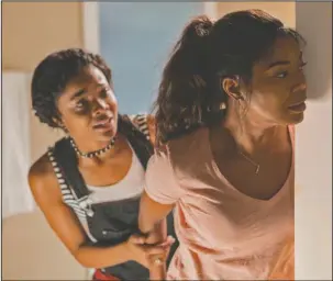  ?? The Associated Press ?? HOME INVASION: Ajiona Alexus, left and Gabrielle Union in "Breaking In."