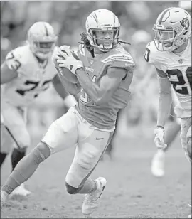  ?? Sean M. Haffey Getty Images ?? MIKE WILLIAMS, gaining yards after a catch against the Raiders, this weekend will be going against Cleveland’s Denzel Ward, whom he faced in college.