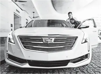  ?? JARRAD HENDERSON, USA TODAY ?? Premium versions of the Cadillac CT6 can drive themselves on the freeway. The Super Cruise function doesn’t work for city driving, which is more complicate­d.