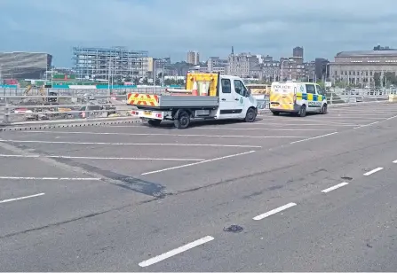  ??  ?? Police at the Tay Road Bridge, where a woman was rescued after falling into the water.