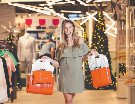  ?? Picture: TROY SNOOK ?? Model and Myer ambassador Rachael Finch might have her hands full but other shoppers are unlikely to have been so generous.