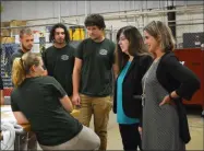  ?? SUBMITTED ?? Principal Tina Pelto and Assistant Principal Megan Champagne talk with Industrial Electricit­y students.