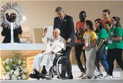  ?? ARMANDO FRANCA AP ?? Pope Francis waves to the crowd of an estimated 1.5 million during the 37th World Youth Day vigil at the Parque Tejo in Lisbon on Saturday.