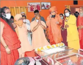  ?? HT PHOTO ?? UP chief minister Yogi Adityanath paying his last respects to Mahant Narendra Giri at Baghambari Math in Prayagraj on Tuesday.