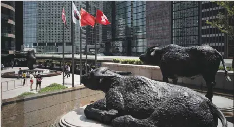  ??  ?? Bull statues displayed outside the Hong Kong Stock Exchange (file). The Hang Seng index closed down 2.4% to 25,601.92 points yesterday.