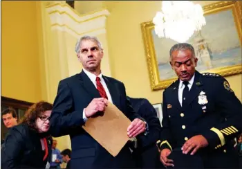  ??  ?? UNDER SCRUTINY: Secret Service Director Mark Sullivan, left, arrives on Capitol Hill in Washington on Dec. 3, 2009, to testify before the House Homeland Security Committee hearing on a White House security breach. At right is Curtis B. Eldridge Jr.,...