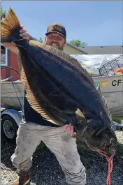  ?? PHOTO COURTESY OF LAWRENCE SOBOLEWSKI ?? McKinleyvi­lle resident Lawrence Sobolewski hauled in this whopping 37-pound California halibut last Friday inside Humboldt Bay.