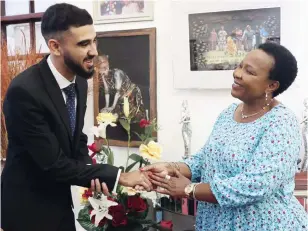  ?? - Picture: John Manzongo ?? First Lady Dr Auxillia Mnangagwa welcomes Mr Seth Van Beek, one of the youngest Zimbabwean commercial pilots who partnered her Angel of Hope Foundation to uplift talented Zimbabwean­s through aviation and engineerin­g scholarshi­ps at Zimbabwe House yesterday.