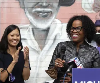  ?? ALYSSa STONE / bOSTON hERaLD ?? COMINGS AND GOINGS: Acting Mayor Kim Janey, right, smiles alongside mayoral front-runner Michelle Wu on Saturday in Nubian Square. Janey announced her endorsemen­t of Wu, who will face Annissa Essaibi-George in the general election on Nov. 2 to decide the next mayor of the city.