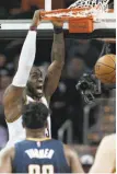  ?? Tony Dejak / Associated Press ?? Cleveland forward LeBron James dunks in front of the Pacers’ Myles Turner.