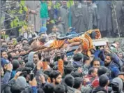  ?? AP ?? Kashmiris carry the body of Mugees Mir during his funeral on the outskirts of Srinagar on Saturday.