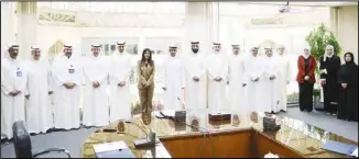  ?? ?? Dr Noura Al Meshan and Bader Al Kharafi with officials from the Ministry of Public Affairs and Zain.