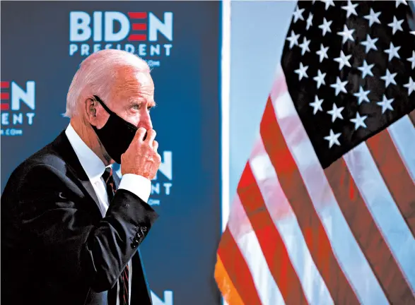  ?? KRISTON JAE BETHEL/THE NEW YORK TIMES ?? Democratic presidenti­al hopeful Joe Biden makes his way from an economic roundtable Thursday in Philadelph­ia.