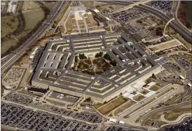  ?? PATRICK SEMANSKY — THE ASSOCIATED PRESS FILE ?? The Pentagon is seen from Air Force One as it flies over Washington, March 2. A new Pentagon office set up to track reports of unidentifi­ed flying objects has received “several hundreds” of new reports, but no evidence so far of alien life. That’s according to the leadership of the All-domain Anomaly Resolution Office.