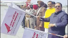  ?? HT PHOTO ?? Union minister Vijay Sampla (yellow jacket), flanked by Rajya Sabha member Shwait Malik (right) and MP Gurjeet Singh Aujla, flagging off the flight in Amritsar on Tuesday.