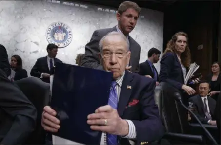  ?? J. SCOTT APPLEWHITE — THE ASSOCIATED PRESS ?? Senate Judiciary Committee Chairman Sen. Charles Grassley, R-Iowa, wraps up the meeting on Capitol Hill in Washington, Monday after his panel voted along party lines on the nomination of President Donald Trump’s Supreme Court nominee Neil Gorsuch.