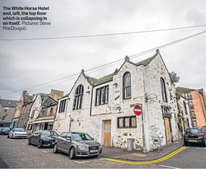  ?? Pictures: Steve MacDougall. ?? The White Horse Hotel and, left, the top floor which is collapsing in on itself.