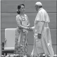  ??  ?? Pope Francis shakes hands with Aung San Suu Kyi in Naypyidaw.