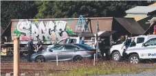  ??  ?? Police at the Port of Brisbane where a body was found.