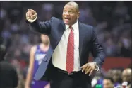  ?? Alex Gallardo / Associated Press ?? Clippers coach Doc Rivers talks to his players during a Feb. 1 game against the Timberwolv­es in Los Angeles. With the return of NBA basketball, players and coaches are determined to ensure they use this opportunit­y and their platform to make polarizing statements at a time when the demand for racial equality is as loud as it has been in generation­s.